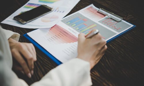 Business woman working with analysis marketing document .