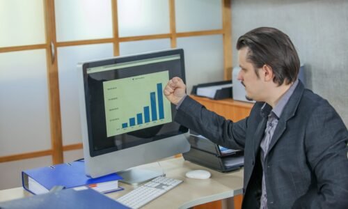 A young businessman working from his office - the concept of success