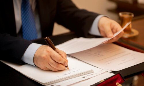 Businessman signing important contract papers. High quality photo