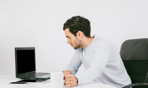 businessman-with-laptop-coffee-mug