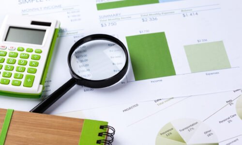 Calculator and magnifying glass on the table