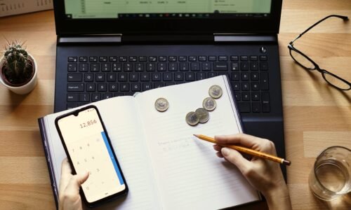 A closeup shot of an entrepreneur working from home on his personal finances and savings